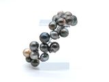 an image of a close up of a bracelet with pearls on it