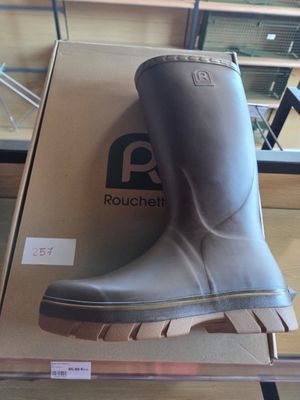 a box with a pair of rain boots on top of it