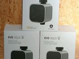 three boxes of the new products are sitting on a wooden surface