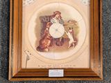 a clock hanging on the wall with a picture of a girl and a dog