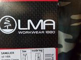someone is holding a box of luma workwear in their hand
