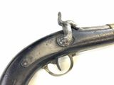 an old gun that is on display on a white surface