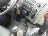 a close up of a car dashboard with a steering control