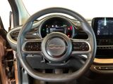 the interior of a car with a steering wheel and dashboard controls