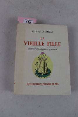 le livre est posé sur une surface blanche, avec une étiquette rose