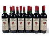 six bottles of red wine are lined up in a row