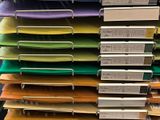several stacks of folders are stacked on top of each other