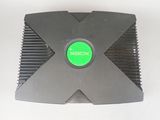 a close up of a green button on a black object