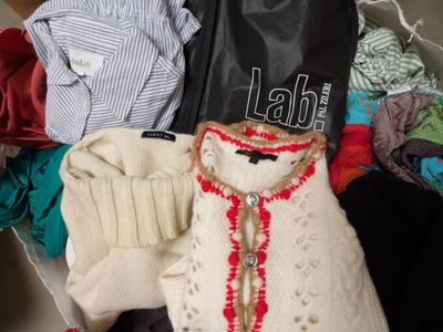 a suitcase full of clothes and a teddy bear in it