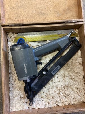 a box with a stapler, stapler, and stapler in it