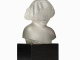 a white marble bust of a woman on a wooden base