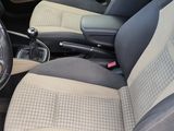 the interior of a car with the front seats folded down