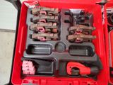 a red tool box with tools in it on the floor