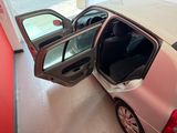 a car that has its door open in a garage