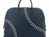 this image may contain a handbag or a purse