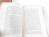 an open book that is sitting on a table