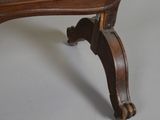 an image of a chair with a needled back and foot rest