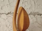 a wooden sculpture that is on a wooden shelf
