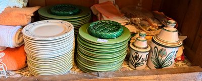 many plates and bowls stacked on top of each other