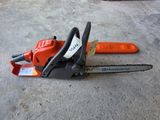 the chainsaw is laying on the ground next to a fork