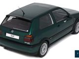 the green car is parked on a white surface with a white background