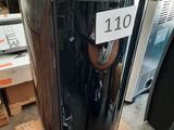 a large metal trash can sitting on a pallet in a warehouse