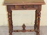 a small wooden table with a drawer on top of it