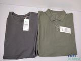 two men ' s polo shirts sitting next to each other on a table