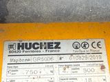 a label on the back of a machine that is sitting on the ground