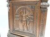 pair of antique carved wood side tables with figures on them