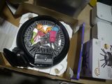 a box with a clock inside of it with a bunch of keys in it