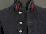 a close up of a military coat on a mannequin mannequin
