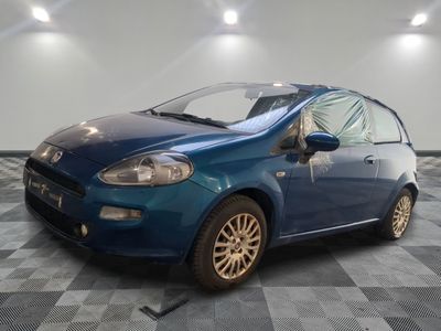 a picture of a blue car parked in a garage