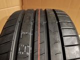a close up of a tire with a red line on the side of it