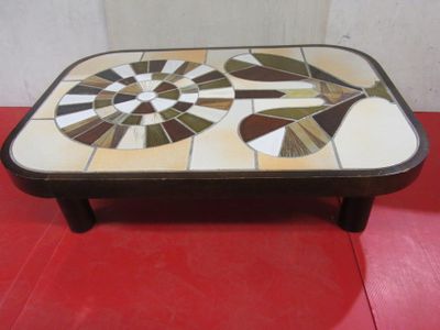 a coffee table that has a mosaic design on it