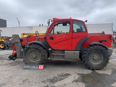 an image of a red tractor parked in a parking lot