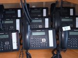 a lot of telephones that are sitting on the floor