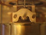 a close up of a clock on a table