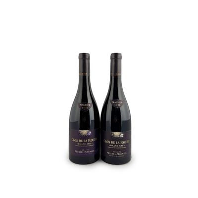 two bottles of wine sitting next to each other on a white surface