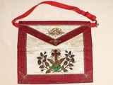a red and white bag with a bird on it