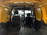two seats in the back of a yellow van