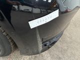 a picture of a car with a sticker on it ' s bumper