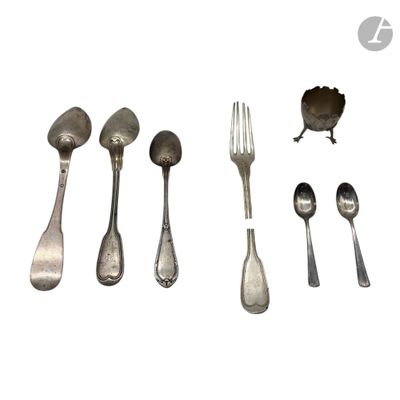 a lot of silver spoons and forks on a white surface