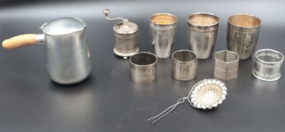 a lot of silver items on a black table