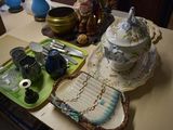 a table that has a tray with a tea pot on it and a tray with a tea pot on it