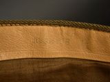 the inside of a brown leather bag with a zipper on it