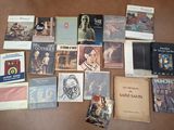many books that are laying out on the floor