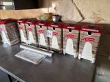 several boxes of food are lined up on a counter in a kitchen