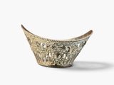 a small silver bowl with a decorative design on the rim