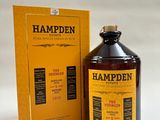 a bottle of hampden is sitting next to a box